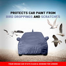 Maruti Baleno car covered with a protective body cover shielding it from bird droppings and scratches