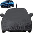 Black Tata nexon car cover protecting a parked Tata Nexon SUV from dust and weather