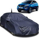 Tata Nexon Car Cover in dark gray fitted over a Tata Nexon SUV protecting the vehicle body